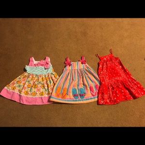 Three piece bundle of 2t girl’s dresses.